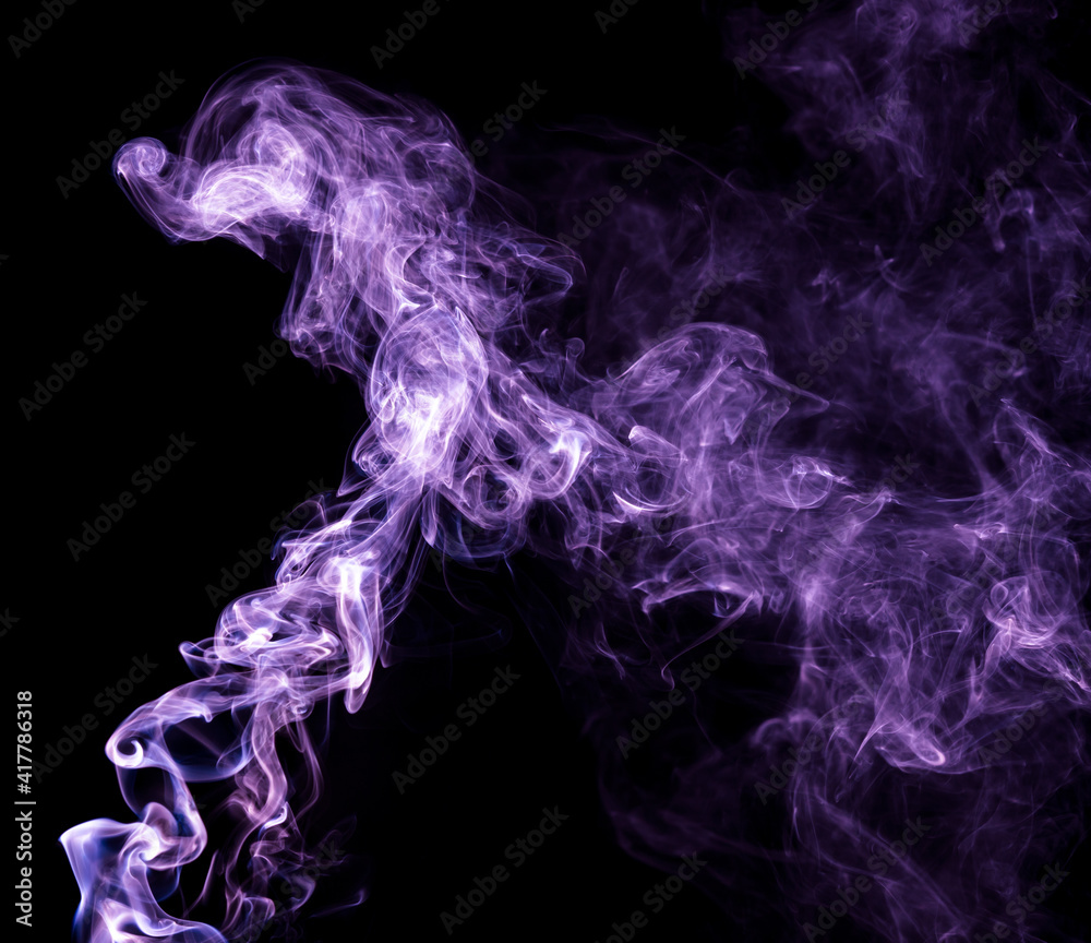 Obraz premium Purple smoke isolated on black background. Abstraction