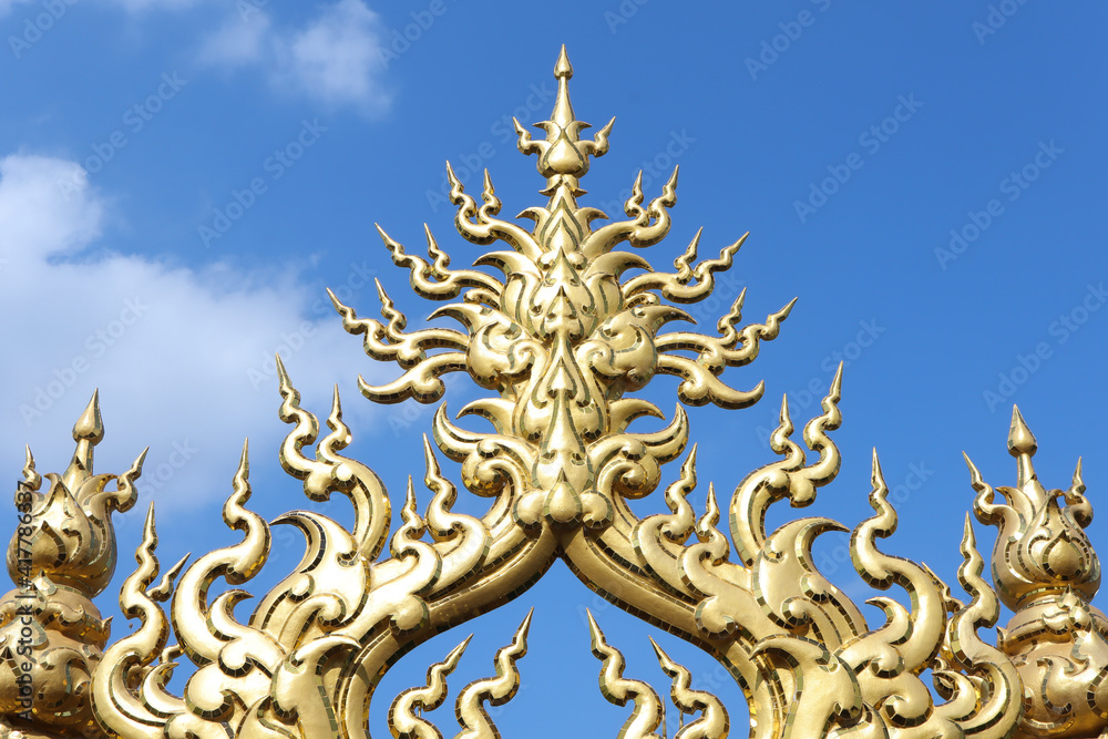 Golden sculpture at Wat Rong Khun or White Temple, Chiang Rai, Thailand.