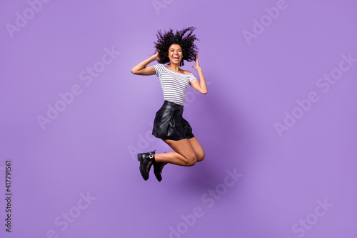 Full length body size view of attractive cheerful girl jumping good mood having fun isolated over purple violet color background