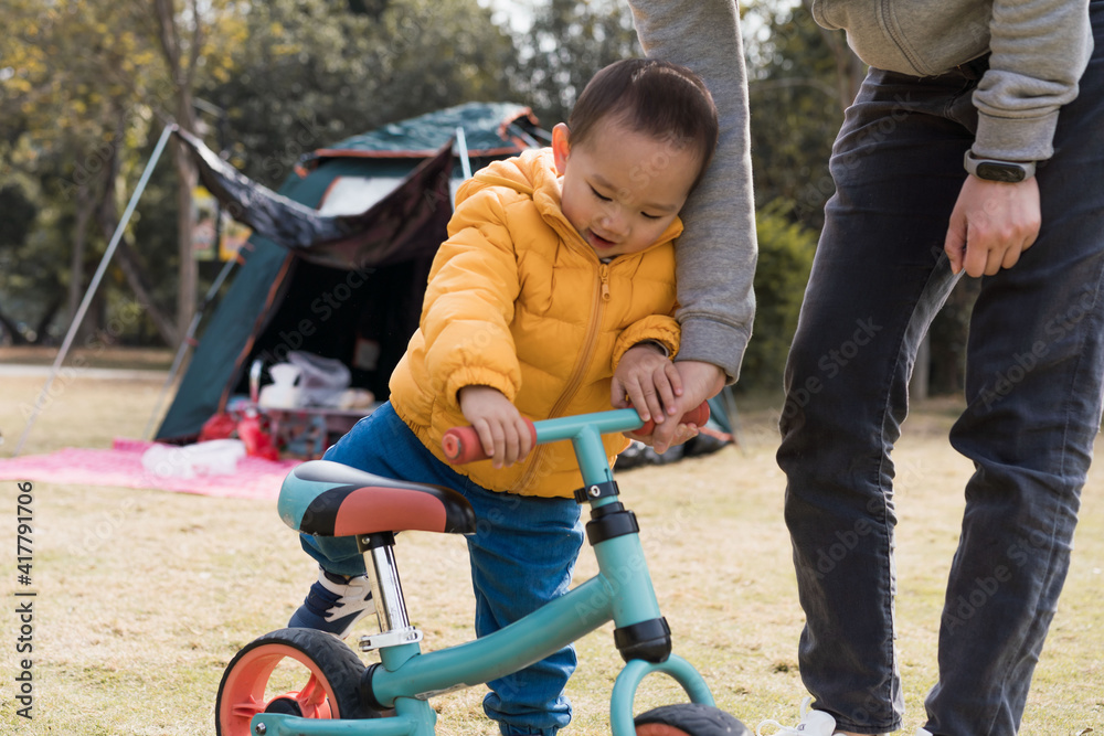 Asian Boys practice riding a balance car outdoors Asian Boys practice riding a balance car outdoors