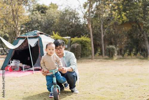 Asian Boys practice riding a balance car outdoors