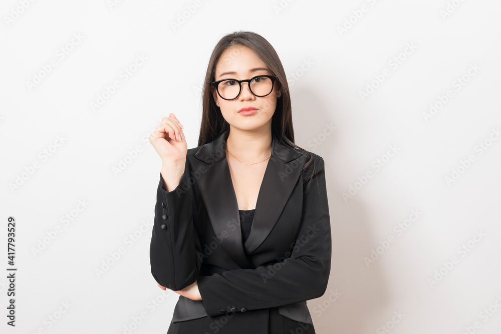 Portrait of Asian woman long hair and wearing suit thinking about success, isolated on white background.