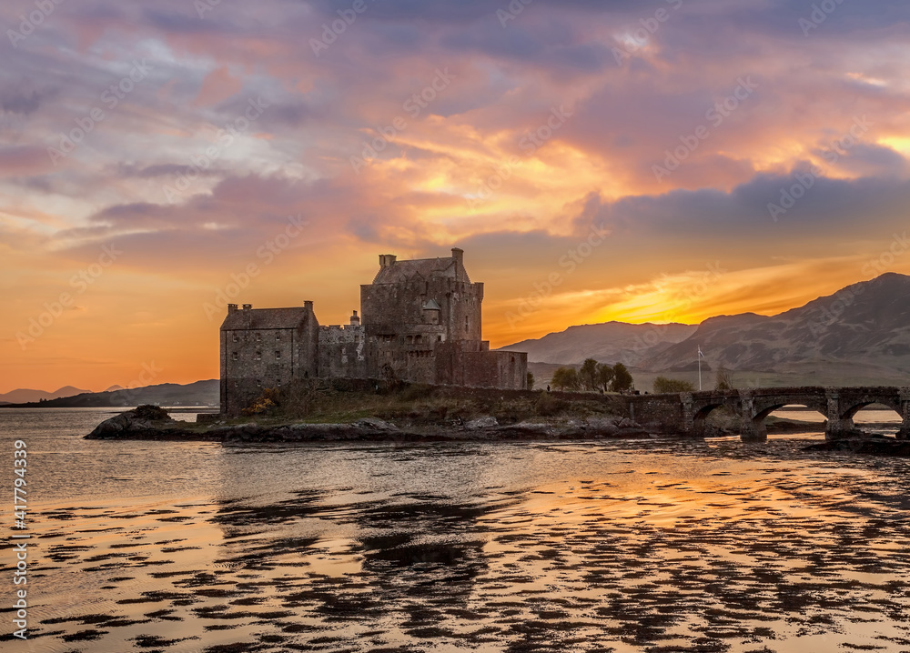 The Eilean Donan Castle with colorful sunset, Highlands of Scotland