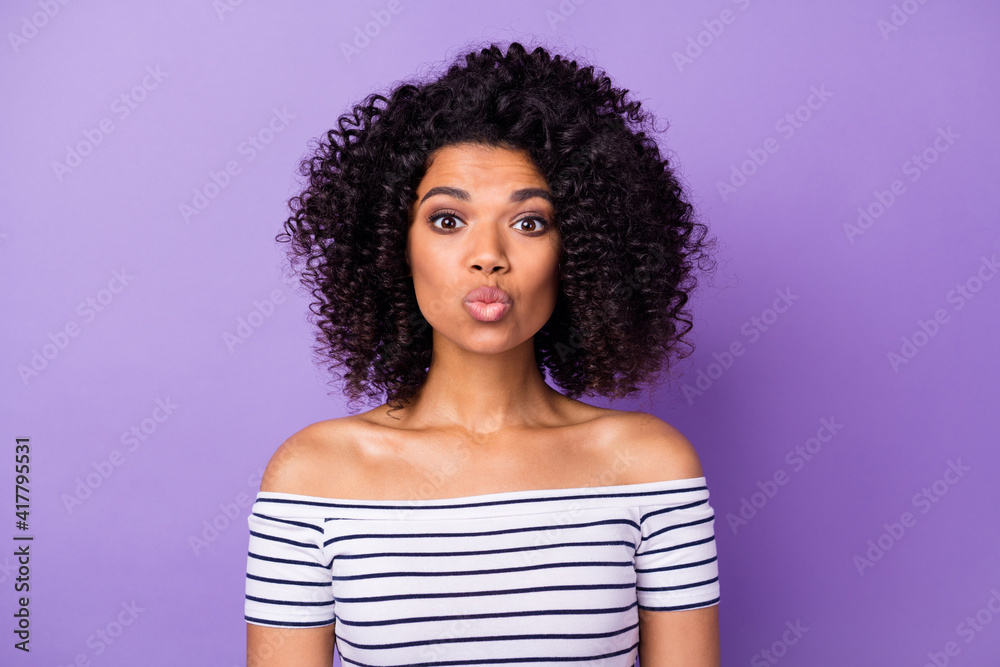Photo of pretty wavy hairdo dark skin person kiss lips look camera isolated on violet color background Photo of pretty wavy hairdo dark skin person kiss lips look camera isolated on violet color background