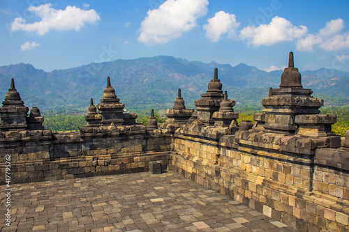 Stone carvings on the side facades of Buddhist Borobudur Temple, Yogyakarta, Java island, Indonesia