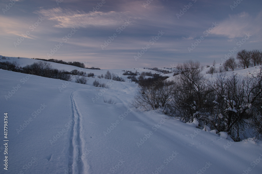Dawn evening winter landscape with ski track Dawn evening winter landscape with ski track