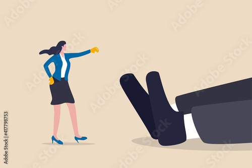 Woman rights, gender inequality fight back, business winning victory concept, brave businesswoman wearing boxing globes just punch knock out giant businessman on the floor.