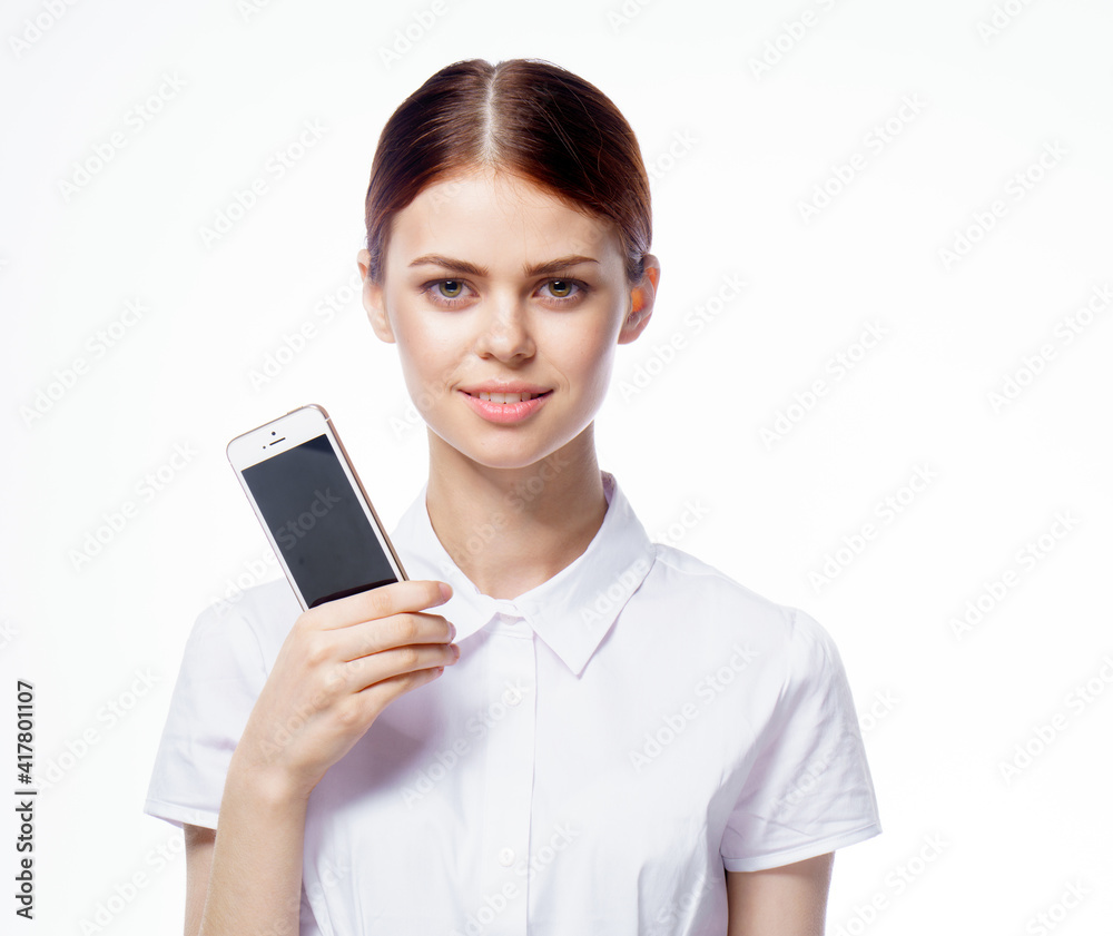 pretty woman in white shirt secretary with phone in hands technology communication pretty woman in white shirt secretary with phone in hands technology communication
