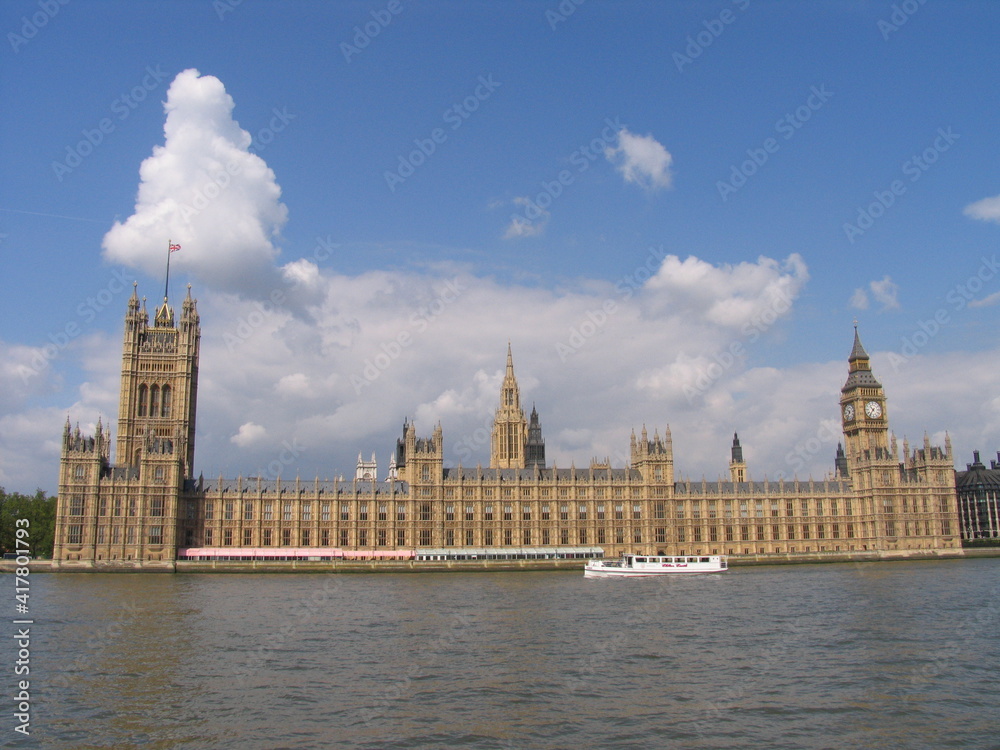 London, United Kingdom - March 25 2005: Westminster palace with the tower bell called Big Ben, in a sunny day. London, United Kingdom - March 25 2005: Westminster palace with the tower bell called Big Ben, in a sunny day.