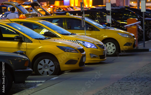 Yellow taxi cars at night in parking in city