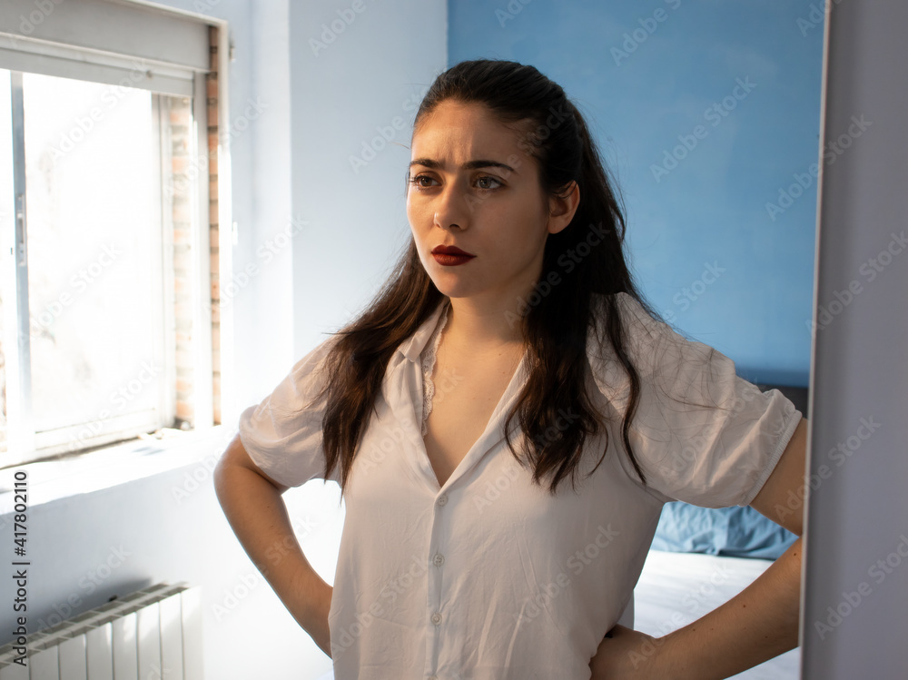 Angry woman in front of the mirror Angry woman in front of the mirror