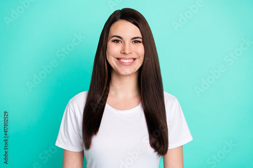 Photo of young cheerful woman happy positive smile teeth veneers stomatology isolated over teal color background © deagreez