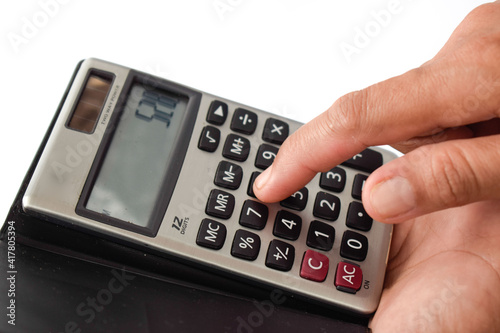 Close up photo of finger and calculator to calculate economy and finance business	 photo