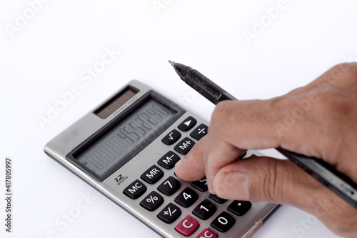 Close up photo of finger and calculator to calculate economy and finance business	  photo