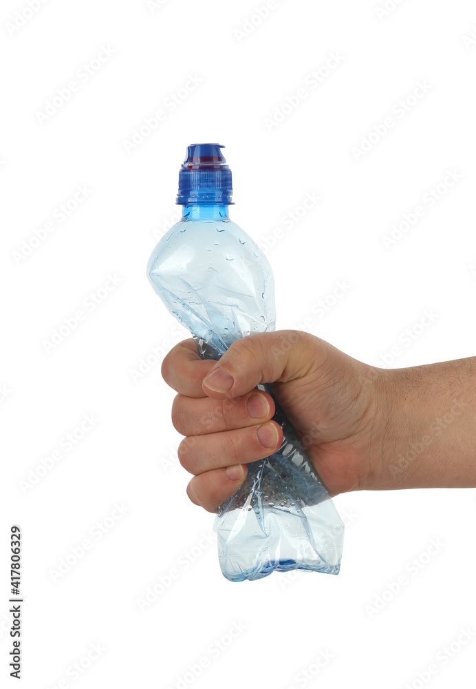 plastic bottle squeezed in a hand plastic bottle squeezed in a hand