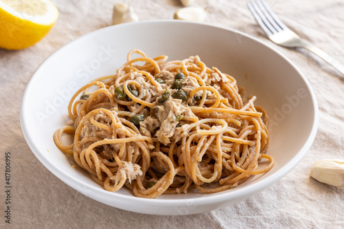 Spaghetti with tuna and capers. Typical Italian pasta dish with tuna.