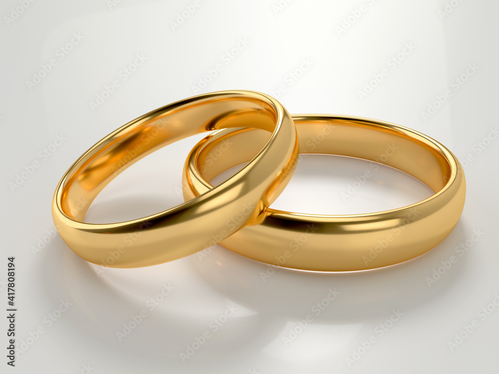 Wedding gold rings lie in each other isolated Wedding gold rings lie in each other isolated