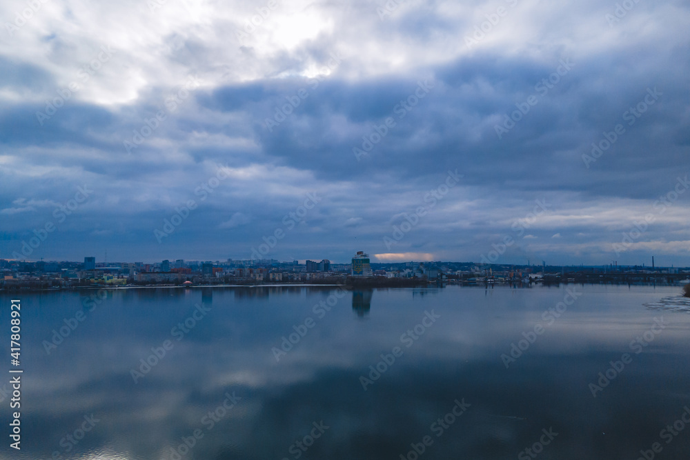 Dark clouds over the city in spring with drone Dark clouds over the city in spring with drone