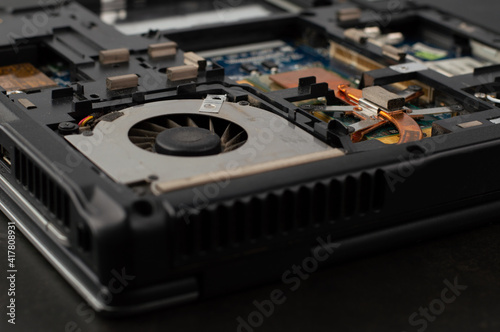 Blurred image of the details of a disassembled laptop.