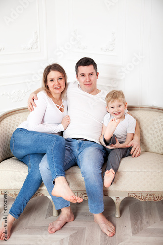 Portrait of happy family with young son