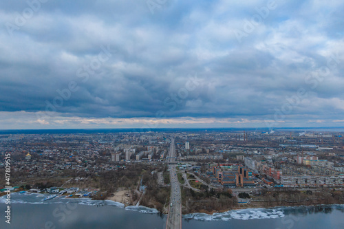 Dark clouds over the city in spring with drone