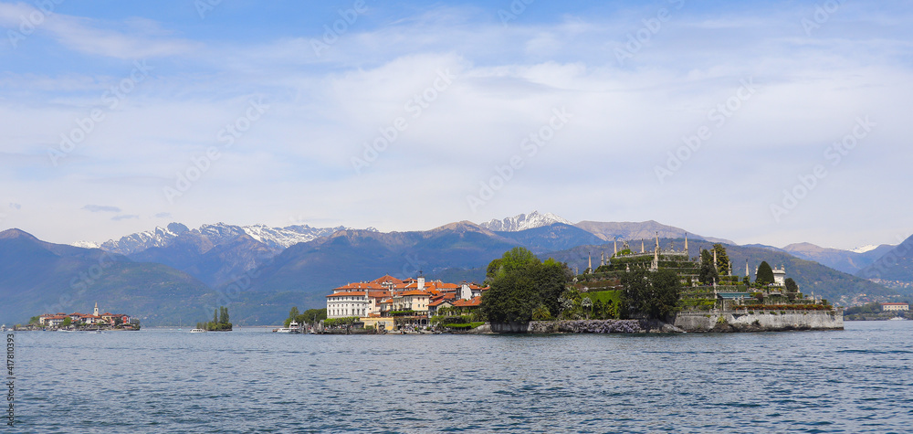 Panoramic view of Lake Maggiore and Isola Bella island in the background of the Alps mountain ranges, Italy