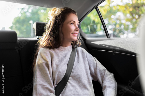 Obraz na plátně transport, vehicle and people concept - happy smiling woman or female passenger