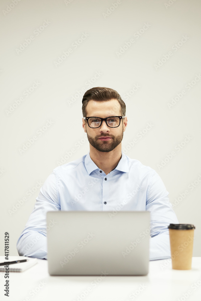 Smart handsome IT specialist at his workplace Smart handsome IT specialist at his workplace