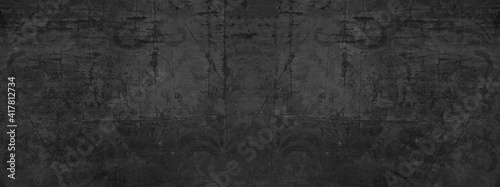 Old black anthracite gray vintage worn shabby patchwork motif tiles stone concrete cement wall texture background banner