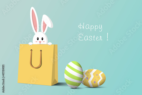 Easter eggs with white rabbit in yellow shopping bag. Shopping on Easter concept.