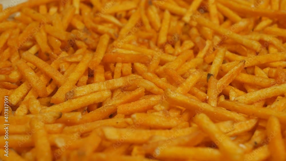 sticks of potato chips. Chips close-up, cyclical rotation. Fatty salty flavorful snack. sticks of potato chips. Chips close-up, cyclical rotation. Fatty salty flavorful snack.