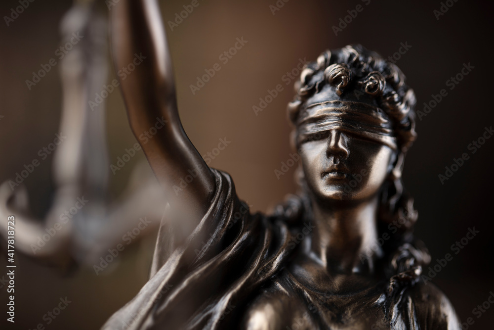 Law concept. Lawyer office. Themis statue on the shelf with legal books background. Law concept. Lawyer office. Themis statue on the shelf with legal books background.