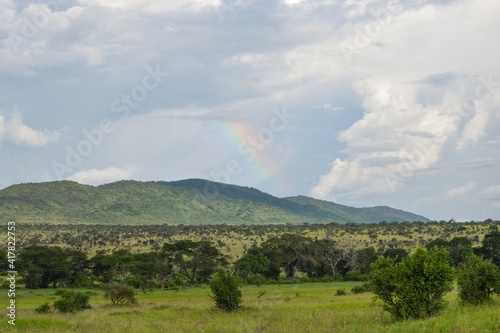 Scenic field against rainbow in Tsavo National Park, Kenya