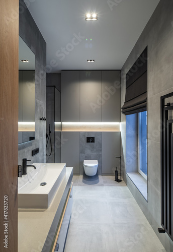 Modern interior in grey tones of bathroom in luxury apartment.