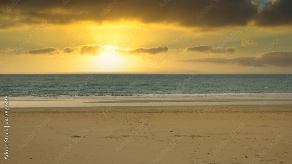 sunset on the beach of andalusia with the sun