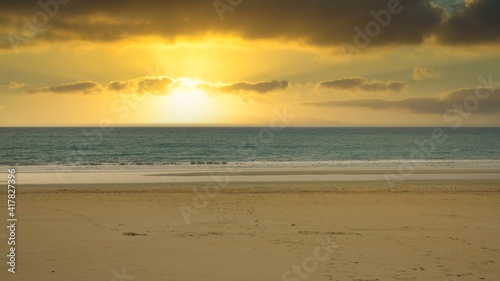 Fototapeta Naklejka Na Ścianę i Meble -  sunset on the beach of andalusia with the sun