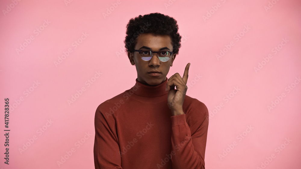 african american teenager in turtleneck sweater and glasses having idea isolated on pink
