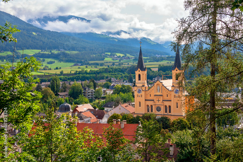 Church of the Assumption of Mary in the old town of Brunico (Bruneck), South Tyrol, Italy. Top view of the historic center of the old city. photo