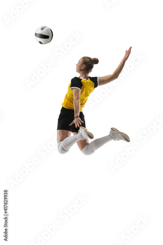 Flying. Young female volleyball player isolated on white studio background. Woman in sportswear training and practicing in action, flight. Concept of sport, healthy lifestyle, motion and movement. © master1305