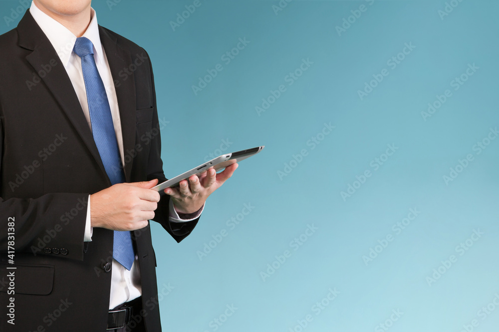 Business online, Businessman handing tablet as online technology management with blue copy space. Business online, Businessman handing tablet as online technology management with blue copy space.
