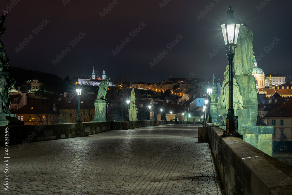 Charles Bridge and lighted lanterns on it and statues