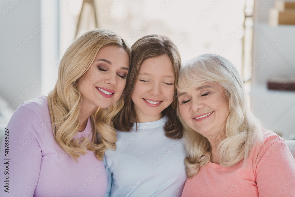 Photo portrait of cheerful mother daughter granny spending time together at home smiling Photo portrait of cheerful mother daughter granny spending time together at home smiling