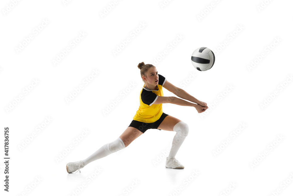 Ready. Young female volleyball player isolated on white studio background. Woman in sportswear training and practicing in action, flight. Concept of sport, healthy lifestyle, motion and movement. Ready. Young female volleyball player isolated on white studio background. Woman in sportswear training and practicing in action, flight. Concept of sport, healthy lifestyle, motion and movement.