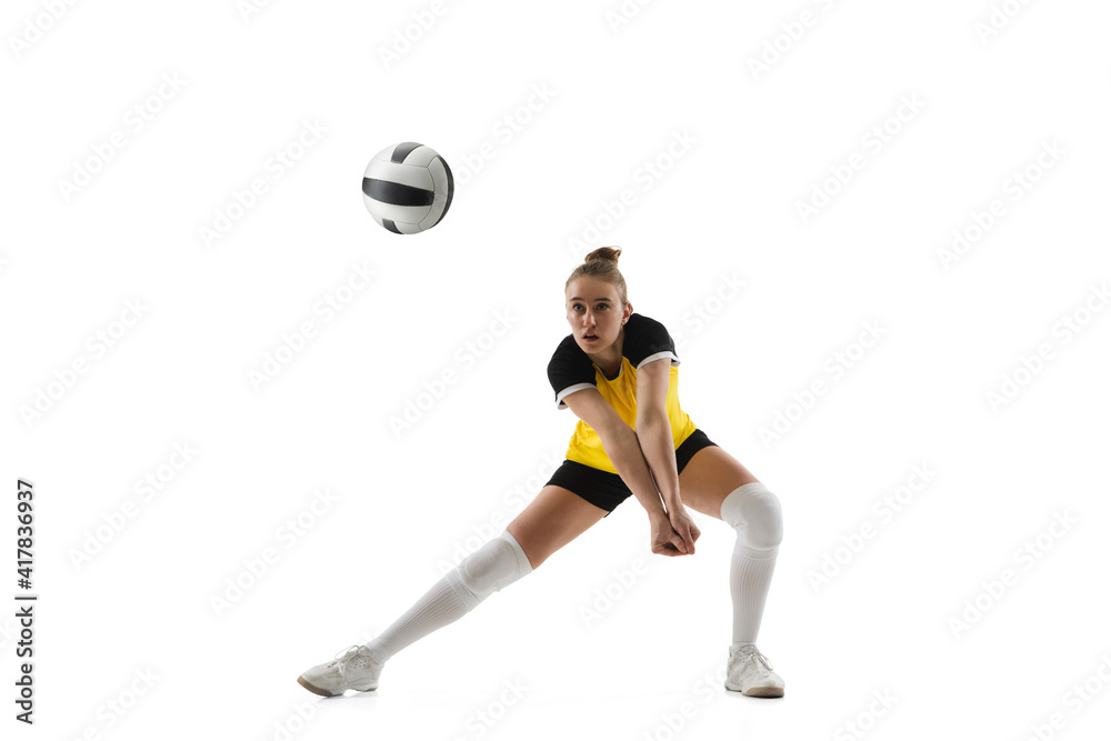 Ready. Young female volleyball player isolated on white studio background. Woman in sportswear training and practicing in action, flight. Concept of sport, healthy lifestyle, motion and movement. Ready. Young female volleyball player isolated on white studio background. Woman in sportswear training and practicing in action, flight. Concept of sport, healthy lifestyle, motion and movement.