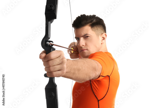 Man with bow and arrow practicing archery against white background, focus on hand