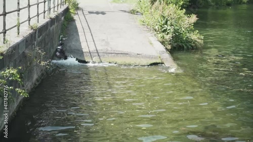 Water sloshes on slope, Huy, Hoei, Belgium, Europe, Ardennes, 1080p, 50fps photo