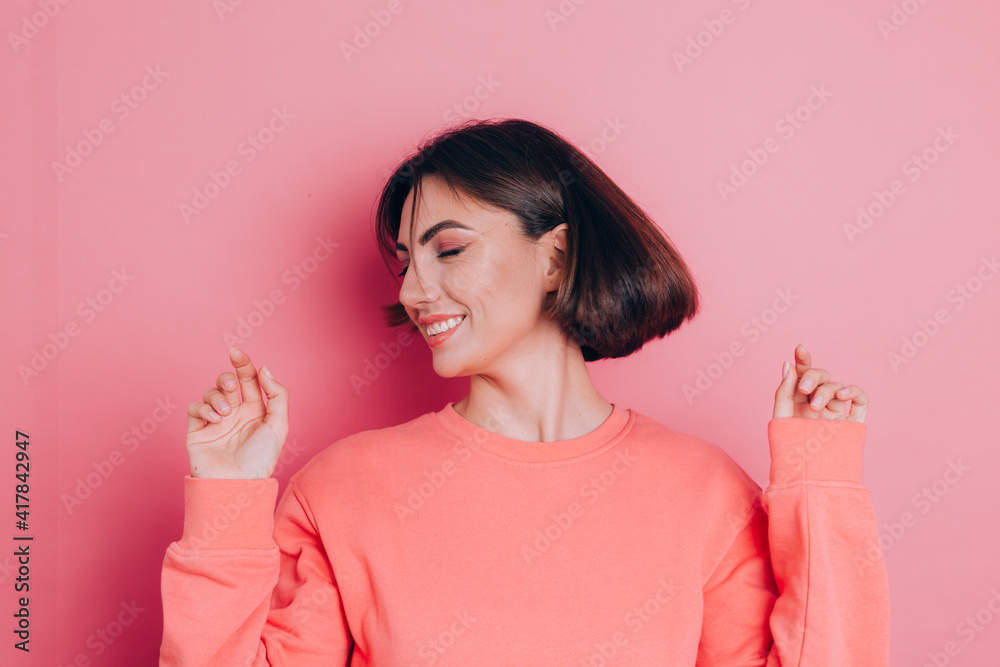 Funny young woman 20s in casual clothes isolated on pink background studio portrait. People emotions lifestyle concept. Mock up copy space. Shaking head with flowing hair Funny young woman 20s in casual clothes isolated on pink background studio portrait. People emotions lifestyle concept. Mock up copy space. Shaking head with flowing hair