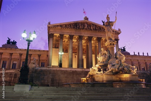 Pallas Athene (Athena) Fountain and Parliament building at night, Vienna, Austria, Europe photo