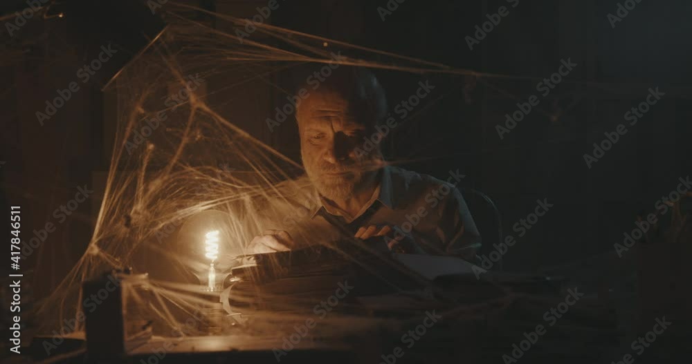 Businessman searching for old files in his abadoned office