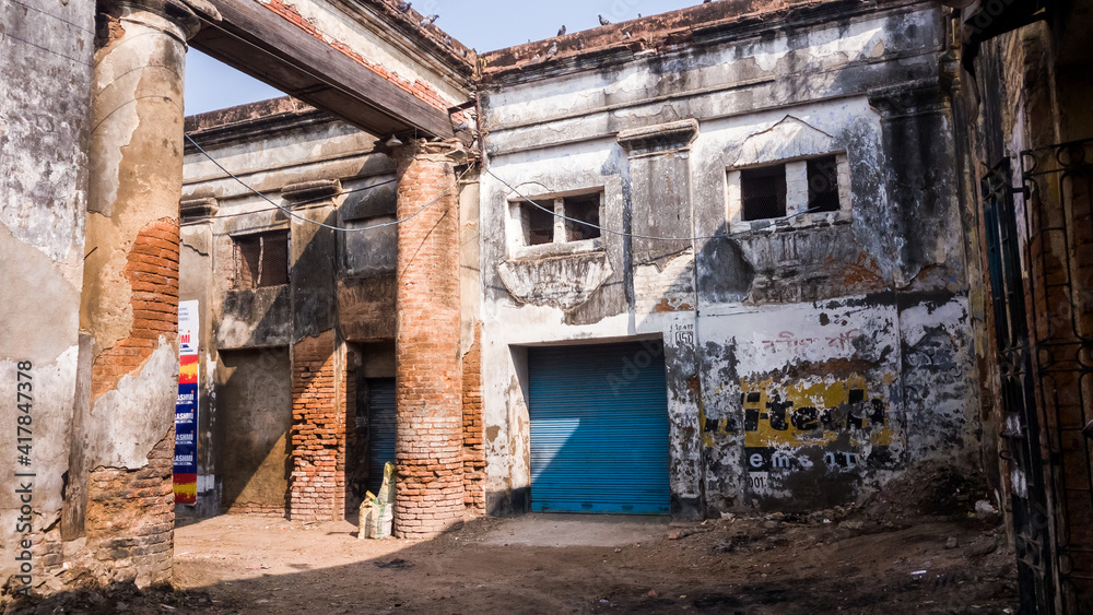 The ruined colonnaded entrance to an old dilapidated market in the town of Murshidabad.